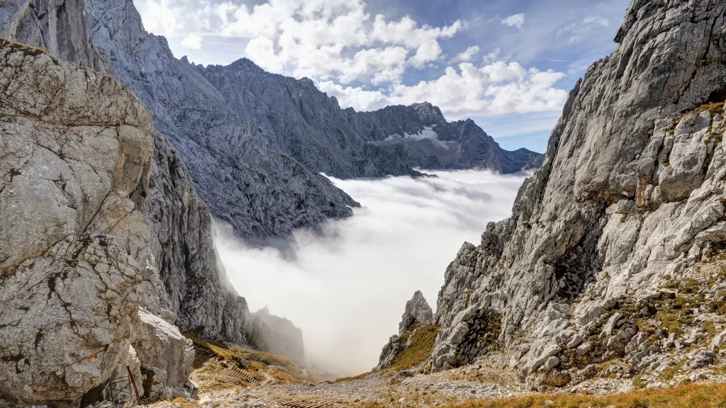 mountains clouds sky rocks valley landscape