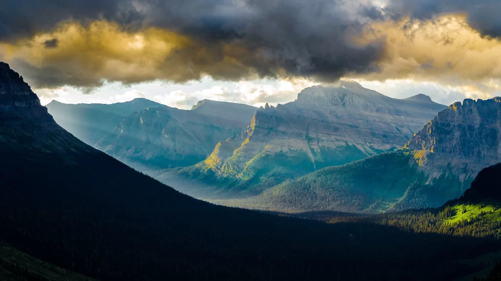 mountains clouds sunlight valley greenery landscape