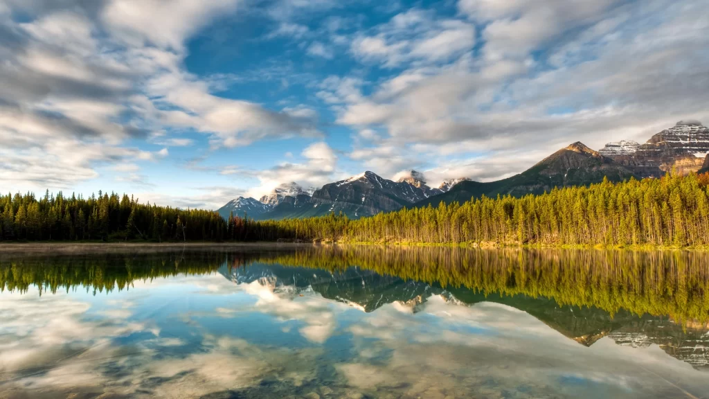 mountains lake reflection forest sky clouds