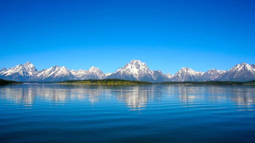 mountains lake reflection sky blue clear
