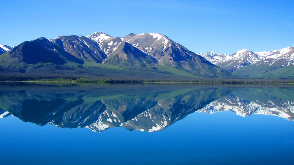 mountains lake reflection snow clear sky