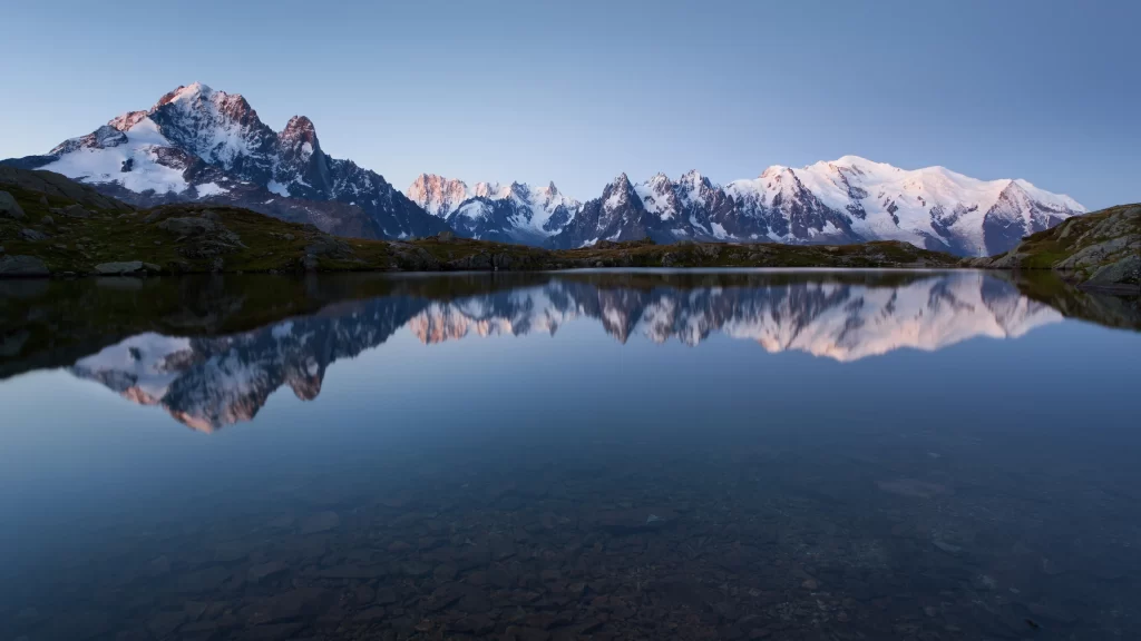 mountains lake reflection snowscape serene landscape