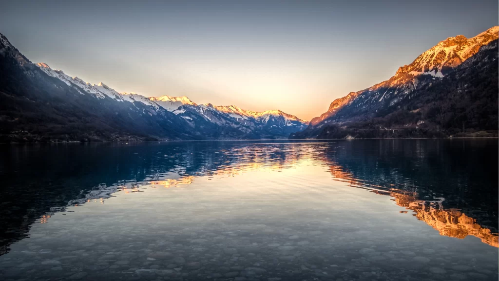 mountains lake reflection sunrise snowscape