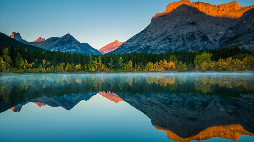 mountains lake reflection sunrise trees