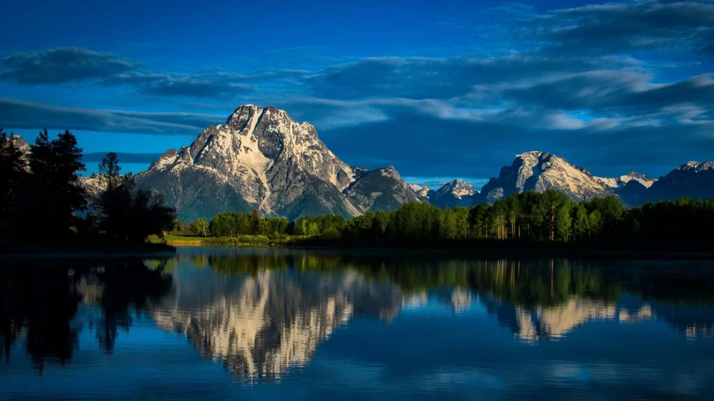 mountains lake reflection trees sky clouds