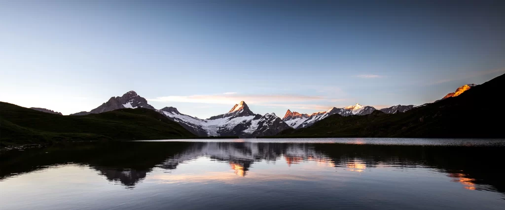 mountains lake sunset reflection sky snow