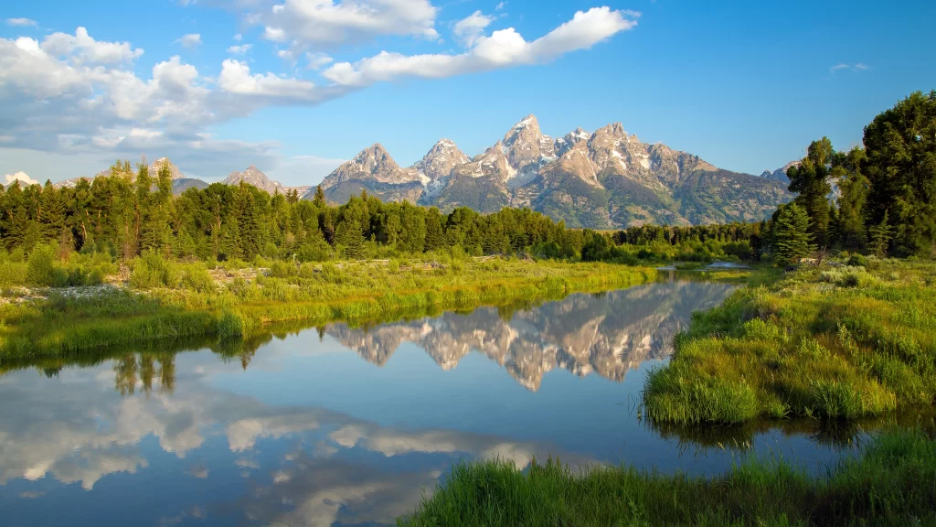 mountains river reflection greenery sky clouds nature landscape