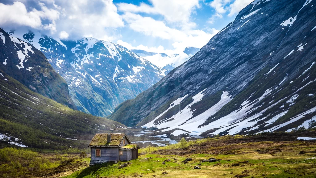 mountains snow cabin valley greenery clouds