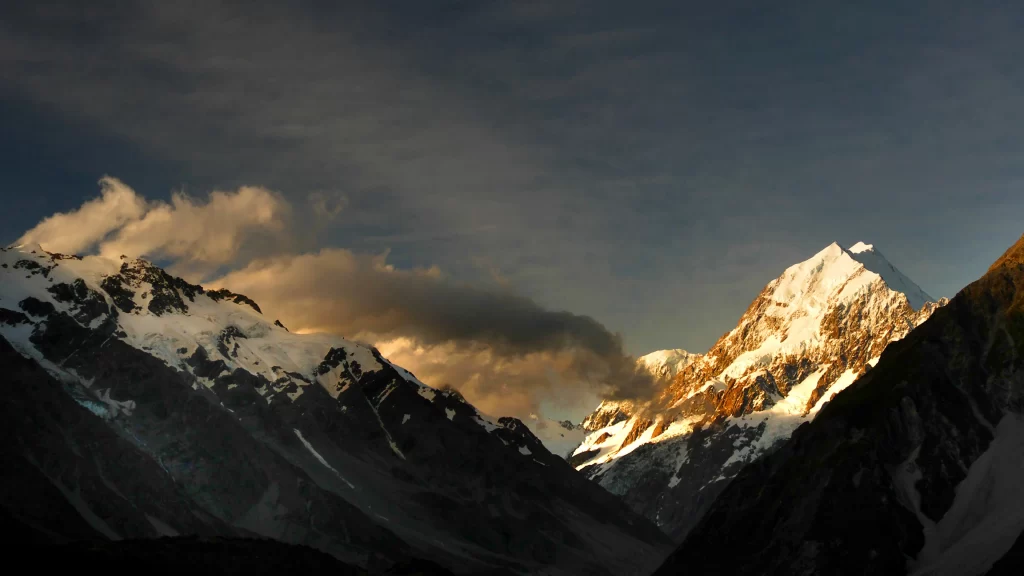 mountains snow clouds sky sunlight