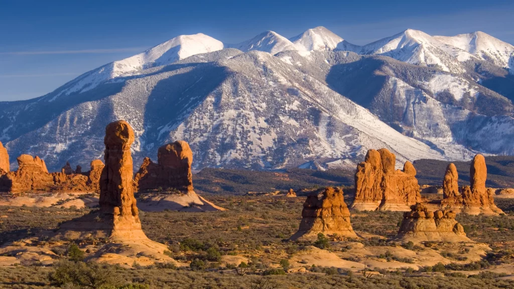 mountains snow desert rock formations landscape