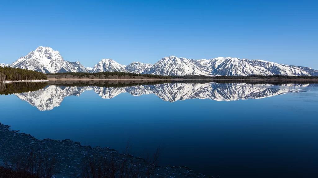 mountains snow lake reflection clear sky