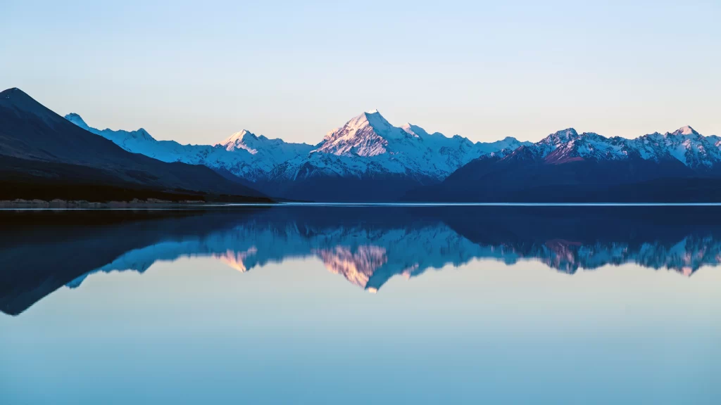 mountains snow lake reflection sunrise