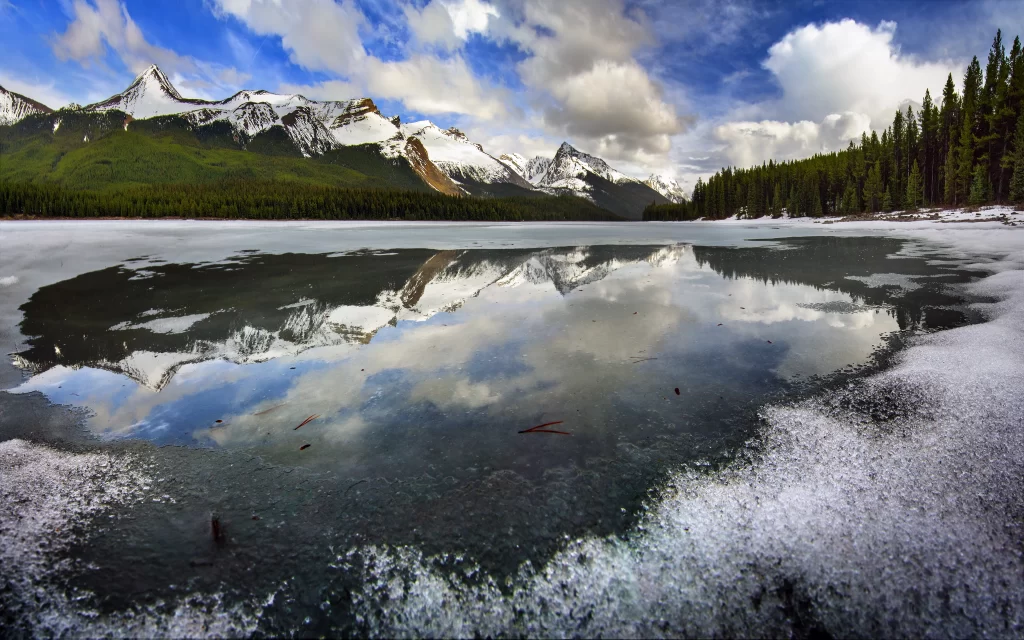 mountains snow lake reflection trees sky