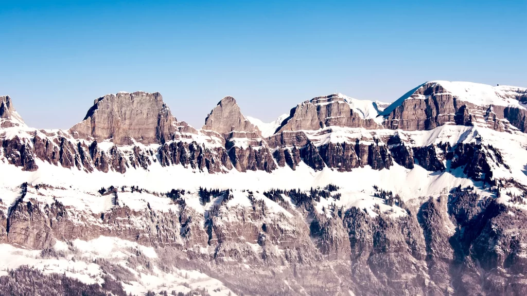 mountains snow peaks clear sky winter