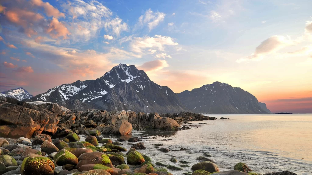 mountains sunset ocean rocks clouds sky