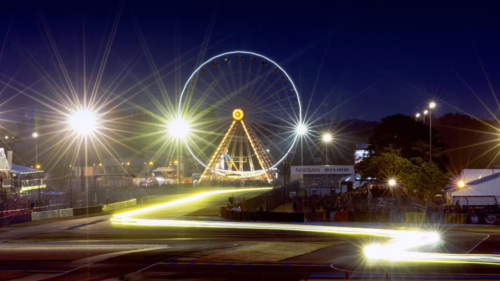 night ferris wheel lights race track motion blur amusement park