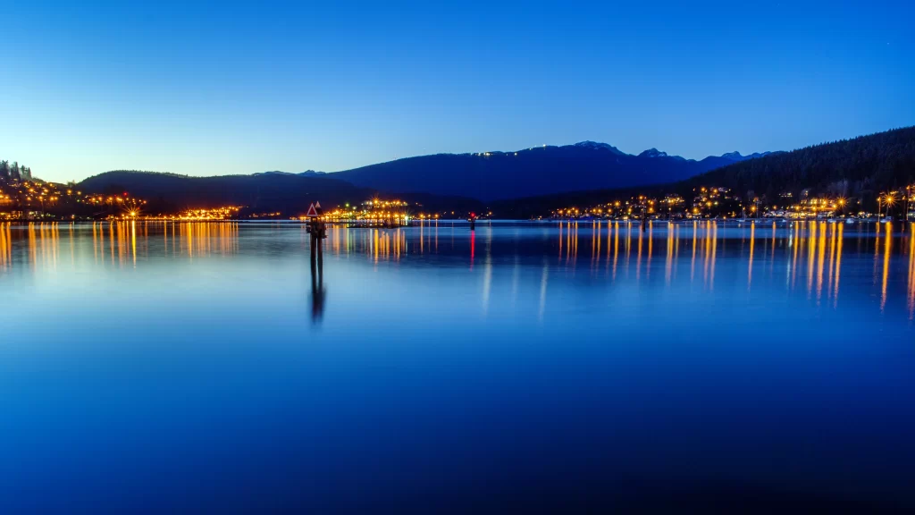 night lake mountains lights reflection calm
