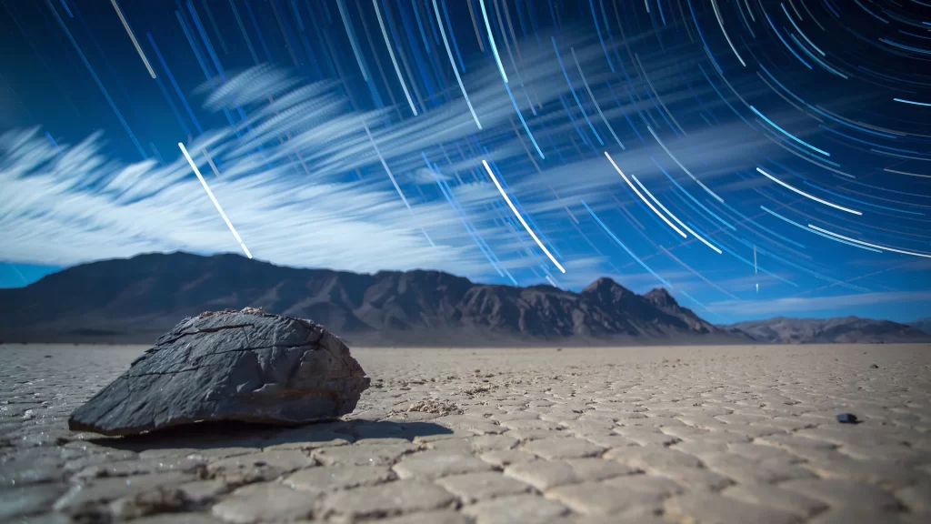 night sky stars desert mountain rock