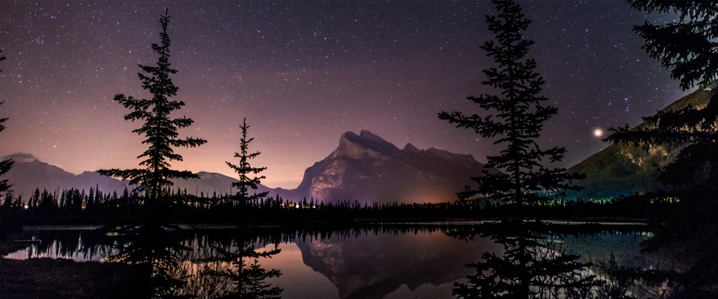 night sky stars mountain lake reflection trees