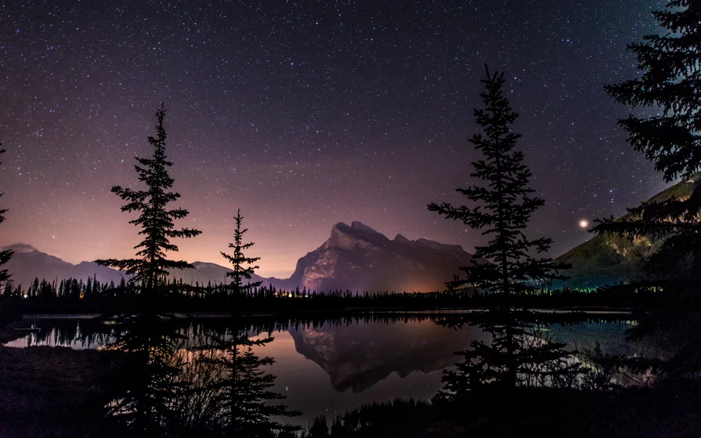 night sky stars mountain lake reflection trees