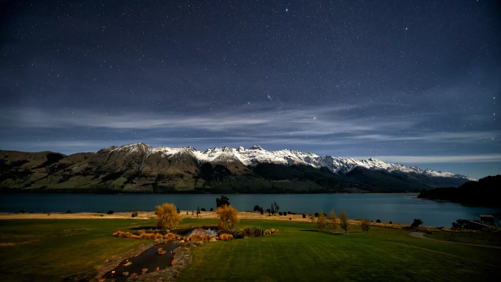 night stars mountains lake grass trees