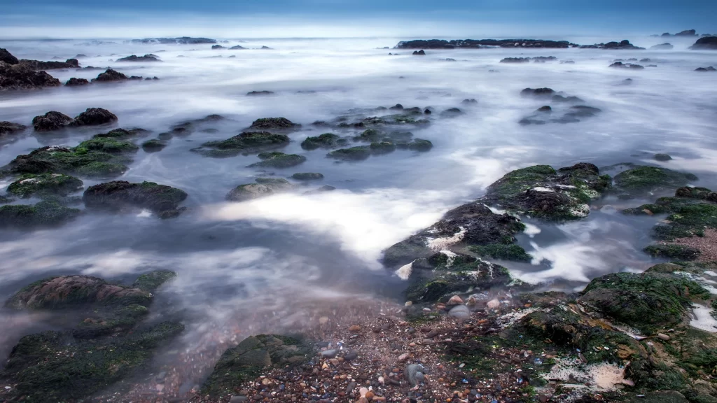 ocean rocks waves water sky