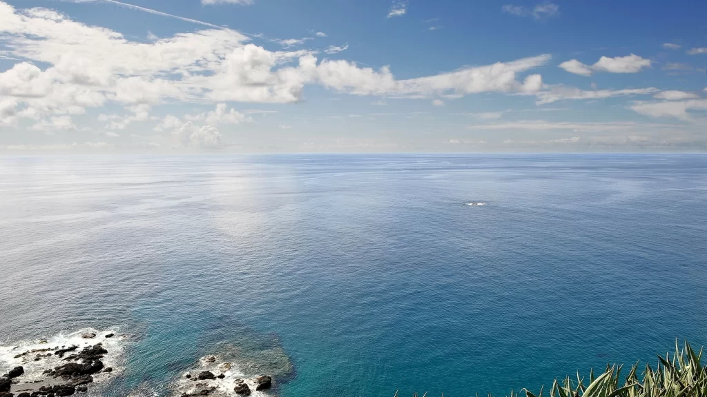 ocean sky clouds horizon water rocks