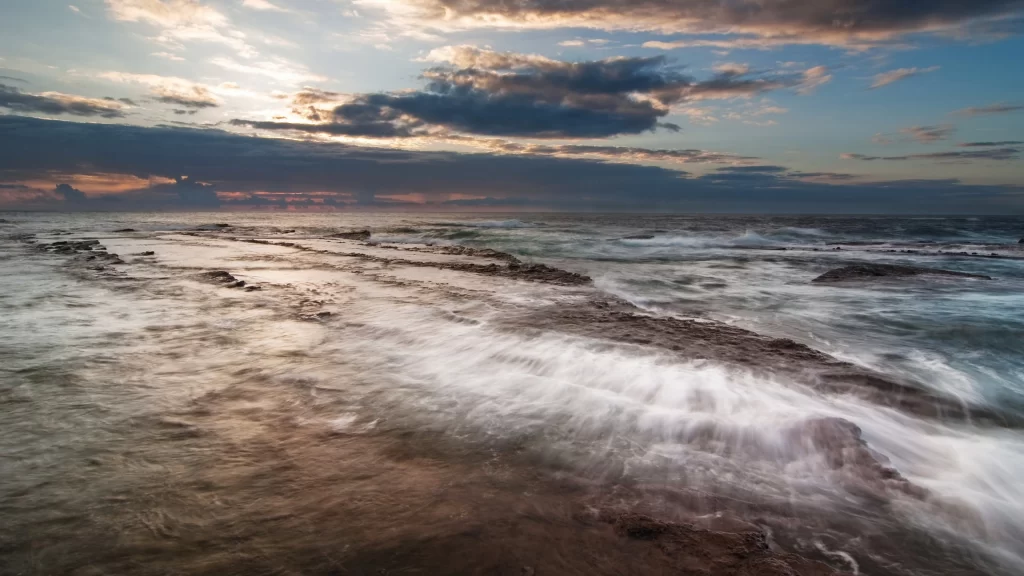 ocean waves sunset sky clouds horizon