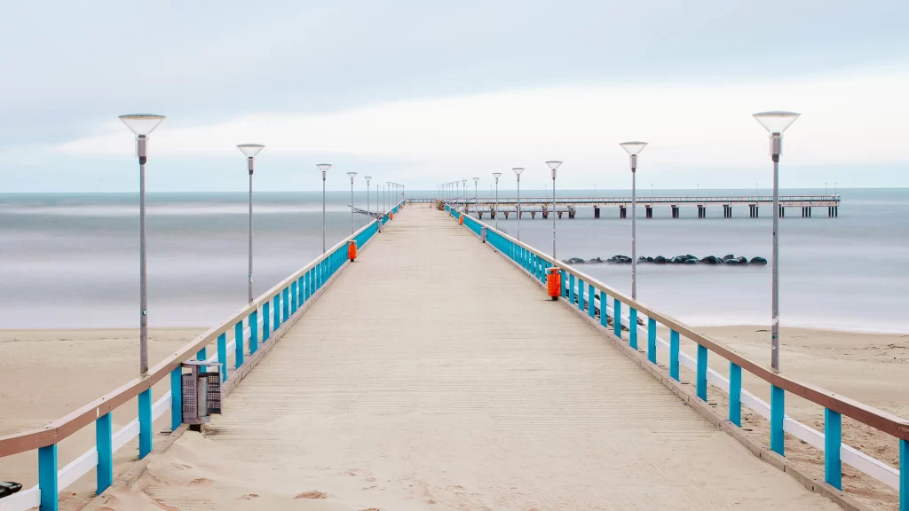 pier ocean beach calm lights railing
