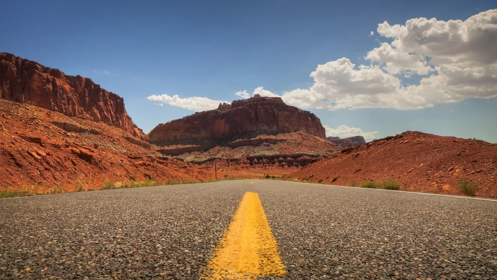 road desert mountains sky clouds landscape