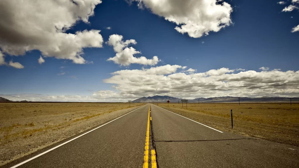 road desert sky clouds landscape horizon
