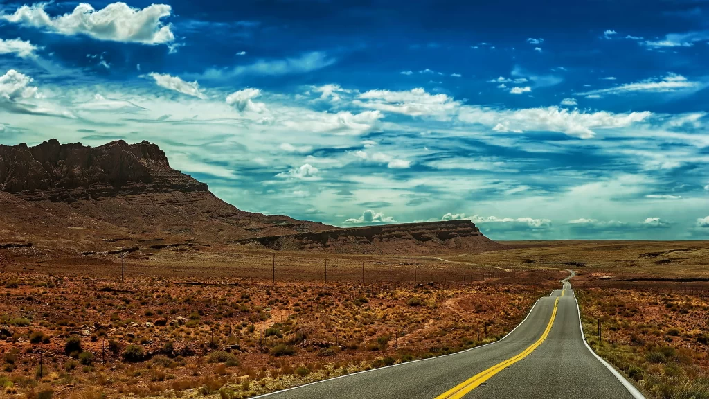 road desert sky clouds landscape journey