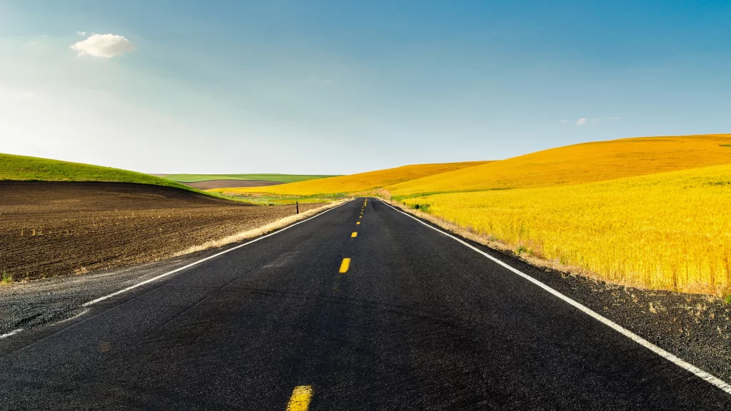road landscape fields sky horizon journey
