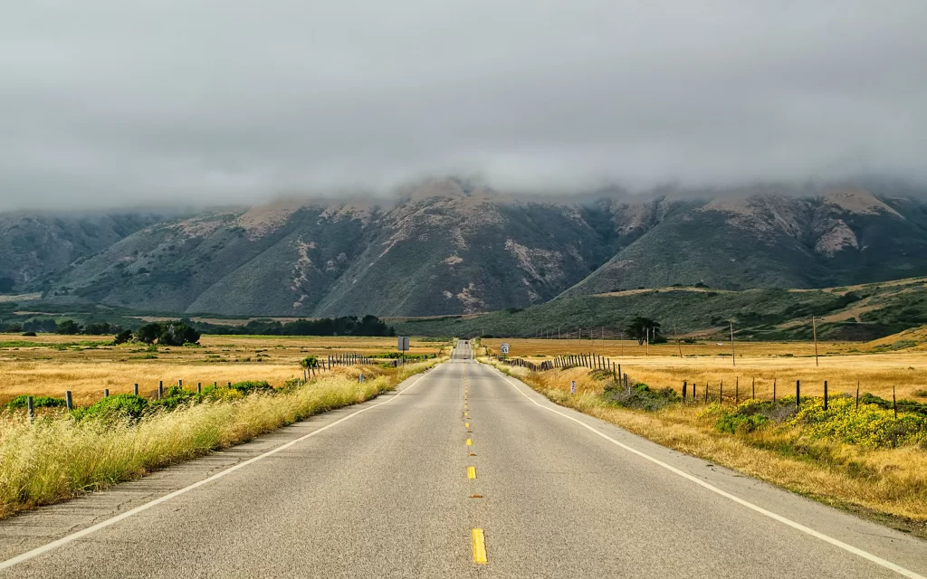 road mountains clouds landscape nature journey