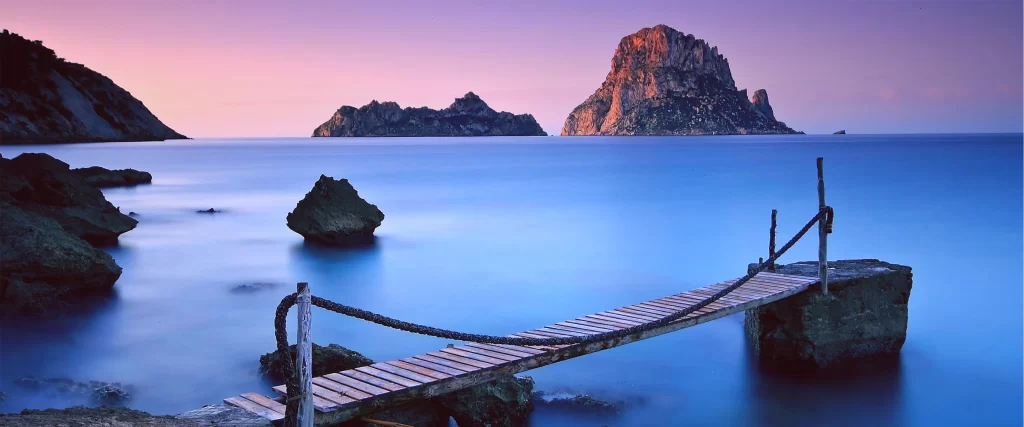 seascape twilight bridge rocks calm