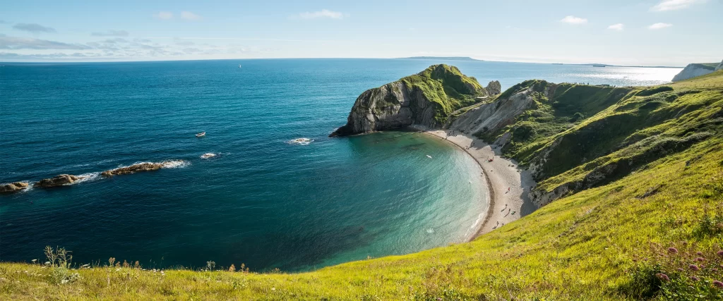 seaside cliffs ocean greenery beach landscape