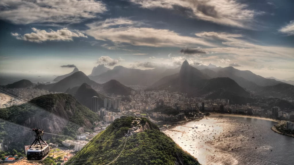 sky clouds mountains city water cable car