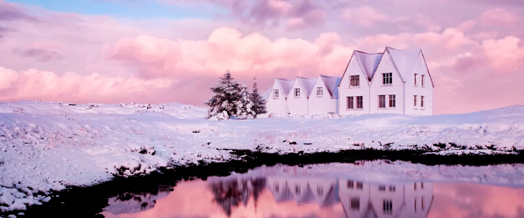snow houses reflection pink sky clouds