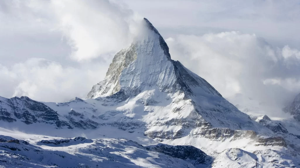 snow mountain peak clouds sky