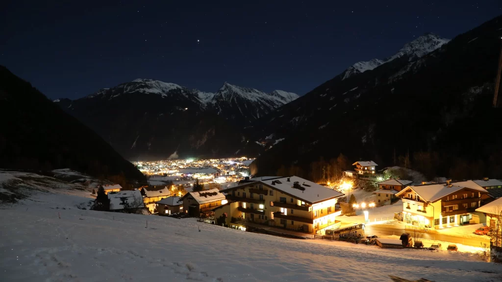 snow mountain village lights night
