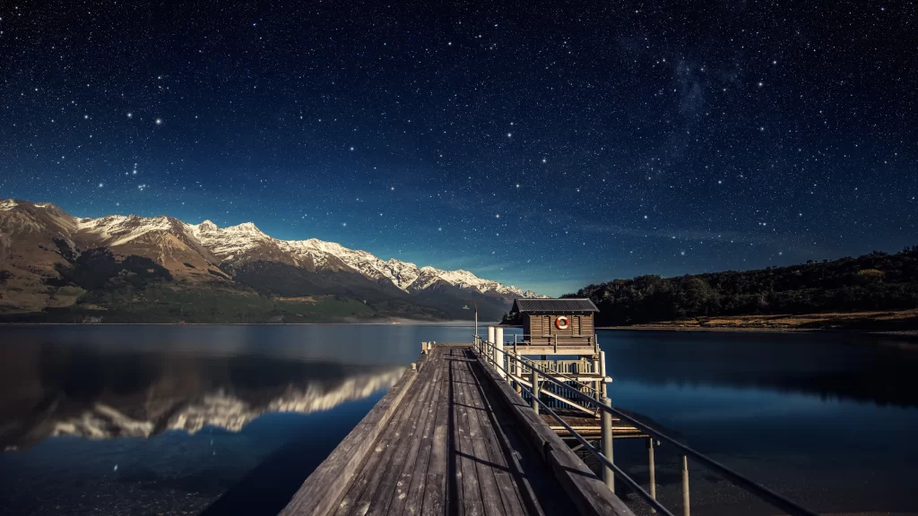 stars night lake mountains dock cabin
