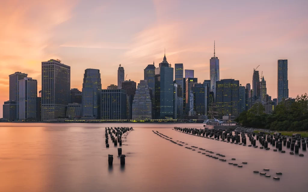sunset cityscape skyscrapers waterfront reflections