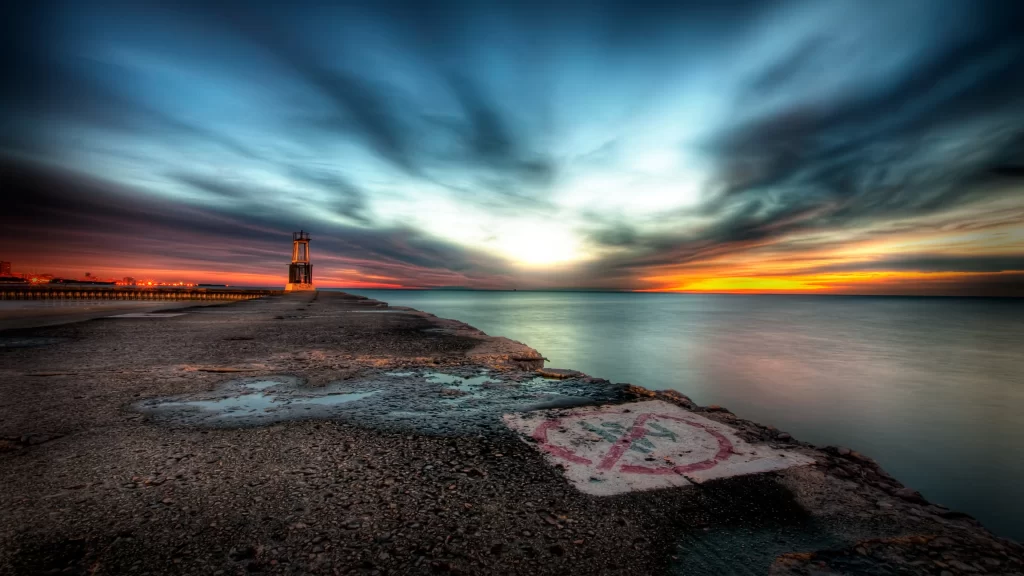 sunset clouds water horizon lighthouse sky