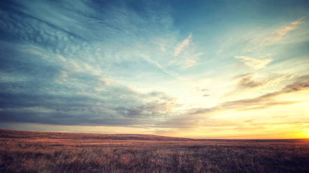sunset sky clouds field landscape horizon