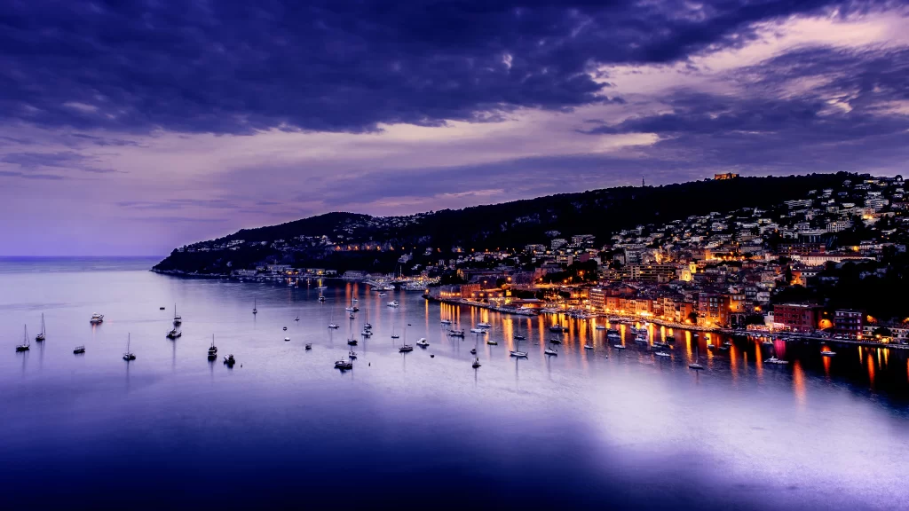 twilight harbor boats cityscape lights reflection clouds tranquility