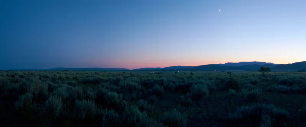 twilight landscape mountains shrubs sky moon