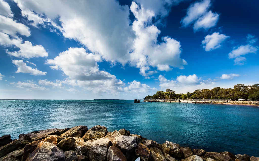 Ocean Waves Rocks Pier Blue Sky Clouds