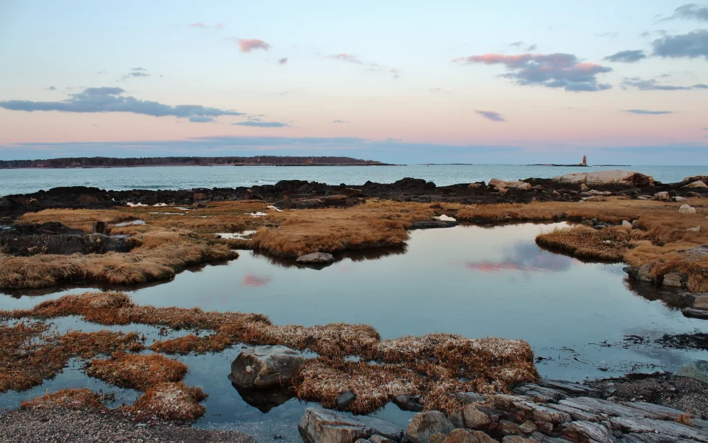 Coastal Landscape Rocky Shoreline Calm Waters Lighthouse
