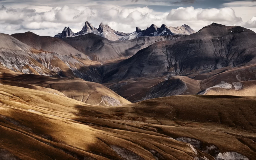Mountain Peaks Clouds Shadows Rocky Terrain