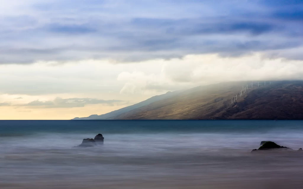 Cloudy Sky Mountain Wind Turbines Ocean Rocks